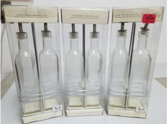 Lot Of 3 Pier 1 Refillable Bottle Sets, Each With 2 Glass Bottles With Pour Spouts & Chrome Caddy