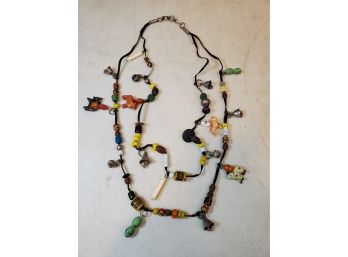 32' Vintage Double Leather Cord Necklace With Art Beads, Mexican Piata Figures, Bells, Etc.
