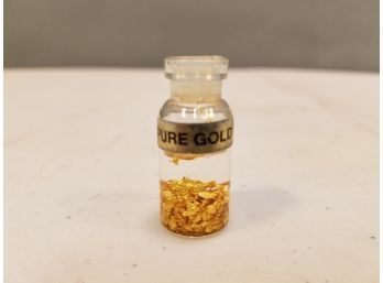 Vial Of Pure Gold Flakes Sealed In Fluid, 1-1/2' High X 5/8' Diameter