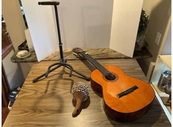 Nylon String Acoustic Guitar, Stand And Percussion Beaded Gourd Shaker.