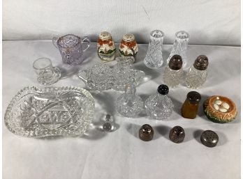 A Mix Of Antique Salt And Pepper Shakers And Small Crystal Containers