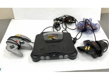 Vintage Nintendo 64 Console And Controllers And Mario Game
