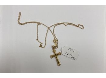 14K Gold Cross And Chain Weighing 1.4 Greams