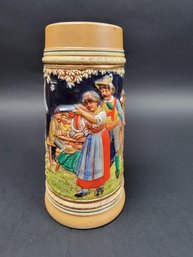 West German Beer Stein With Woman Shooting A Gun With Her Eyes Closed