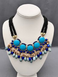 Fun Boho Gold Tone Necklace With Turquoise Color Cabochons And Lapis And Blue Gray Dangles With Soft Rope