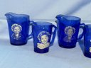 Lot Of 7 Pieces, Shirley Temple, 4 Cream Pitchers, 3 Mugs, Some Worn Spots