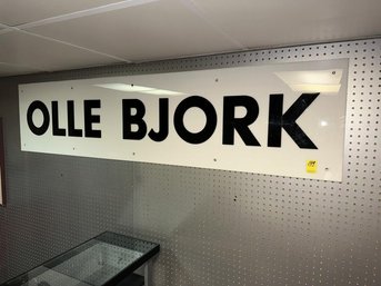 Plastic Sign With Black Letter: Ollie Bjork,  18' Tall X 77' Wide
