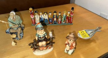 Lot Of Assorted Items: (2) Hummels With  Damage; Fisherman; Asian Figures; Peter Pots  Fish