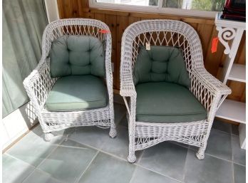 Pair Of White Wicker Arm Chairs With Green Cushions , Cushions Faded