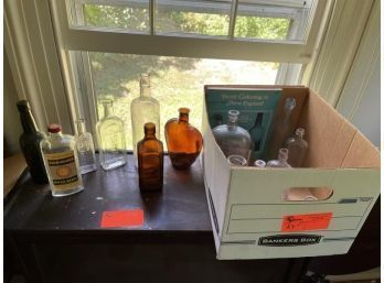 (2) Boxes Of Glass Bottles With Hard Covered Book