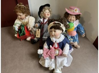 Lot Of (4) Porcelain Dolls, Sitting Peanut, Sitting Florence Nightingale, Sitting Joy's First Christmas, Sitting Girl With Balloons