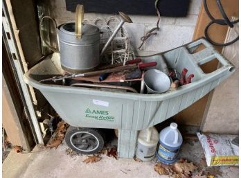 Lot Of Garden Supplies Including Wheel Barrel, Tools, Watering Can, White Metal Fencing