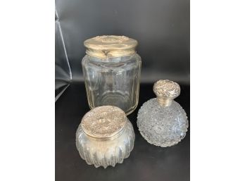 3 Glass Vessels With Silver Tops