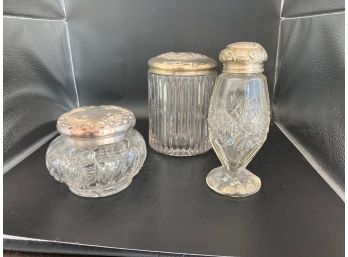 Three Glass Vessels With Dilver Tops