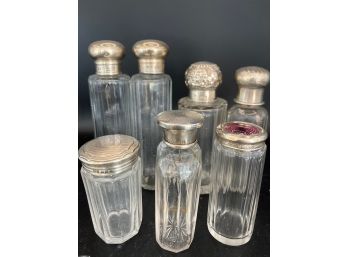 Seven Bottles With Silver Tops