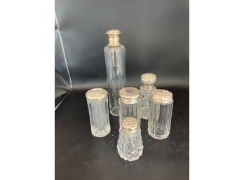 Six Glass Bottles With Silver Tops