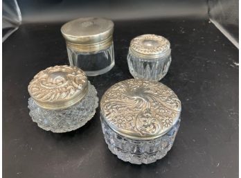 Four Glass Boxes With Silver Lids