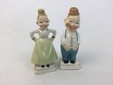 Small Grumpy Man And Woman Figurines