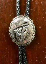 Black Leather Bolo With Stamped Silver Concho