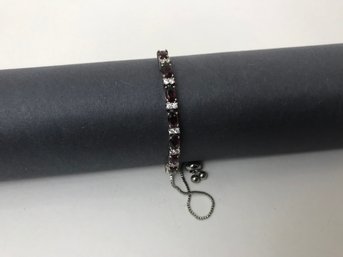 Faceted Purple Gemstone Set In Adjustable Silver Plate Bracelet