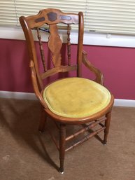 Ornate Antique Chair With Gold Colored Seat Pad