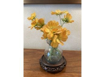 Cheery Silk Blooms In Glass Vase On Carved Wood Stand