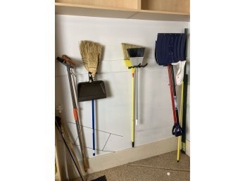 Group Of Handy Shovels, Brooms, And Mop