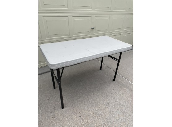 COLLAPSIBLE PLASTIC TOP TABLE- SIZE NOT NOTED -APPROX. SIZE 4FT X 20'