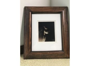 Framed Photo Of Woman In Contrasting Light