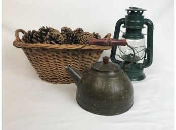 Trio Of Rustic Elements-Woven Basket With Pinecones, Metal Teapot, Green Metal Lantern