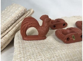 Neutral Woven Table Linens With Terra-cotta Rooster Napkin Rings
