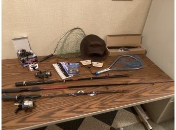 Assortment Of Fishing Related Items Including Near New Fishing Rods And Reels And Two Nets