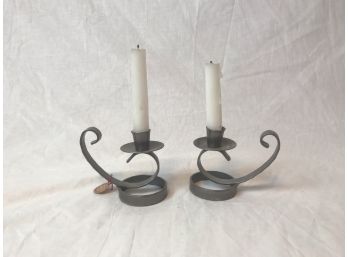 Set Of White Candles On Gray Stylized Candleholders