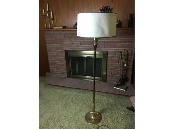 Brass Floor Lamp With Light Colored Lamp Shade