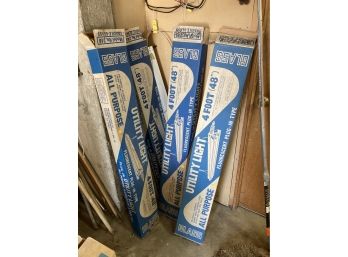 4 Fluorescent Light Fictures In Original Boxes And Varying Conditions 4 Feet Long