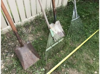 Two Leaf Rakes And Two Flat Shovels
