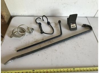 Assortment Featuring Long Crowbar, Tire Bar, Shipping Wedge, Bungee Cord And Steel Table