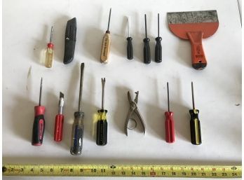 Assortment Featuring Variety Of Screwdrivers, Orange Putty Knife, And Box Cutter