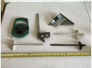 Assortment Of Measuring Devices Including 25 Foot Tape And Speed Square With Instructions