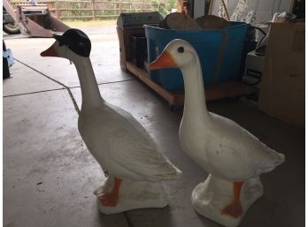 Two Matching Geese Yard Ornaments (one With Miniature Baseball Helmet)