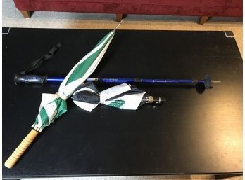 Two Umbrellas And A Ski Pole