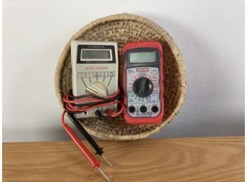 Wicker Basket With Red Craftsman Brand Multimeter And Gray MICRONTA Brand Multimeter