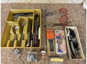 Wide Variety Of Kitchen Utensils And Assorted Silverware With Divider