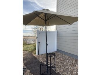 Three Level Plant Stand With Tan Yard Umbrella Zip Tied To It (handy And Interesting Idea)