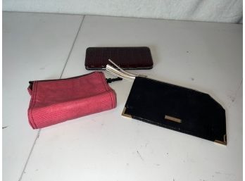 Assortment Of Wallets And Makeup Bag