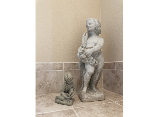Large Cast Child Statue Figure Standing And Smaller Cast Statue Of Child Playing With Butterfly