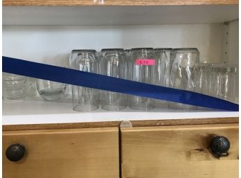 Shelf Of Assorted Glass Drinking Glasses