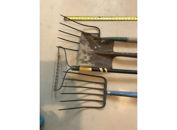 Two Pitchforks, Garden Rake, And Flat Shovel