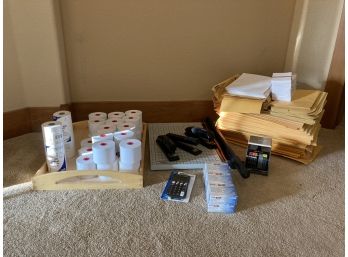 Assortment Of Office Supplies Including Paper Cutter, Padded Envelopes, Staplers, Paper Rolls, And More