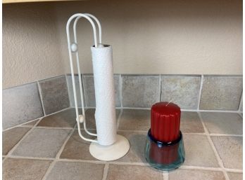 Metal Paper Towel Rack And Red Candle In Blue Hand Blown Glass Vase